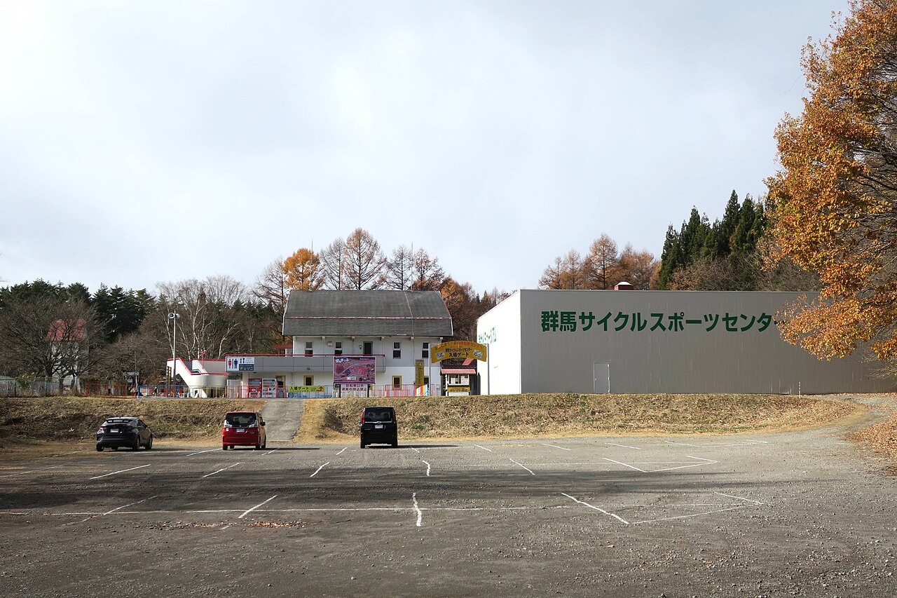 The Gunma Cycle Sports Center building and car park at Gunsai in autumn