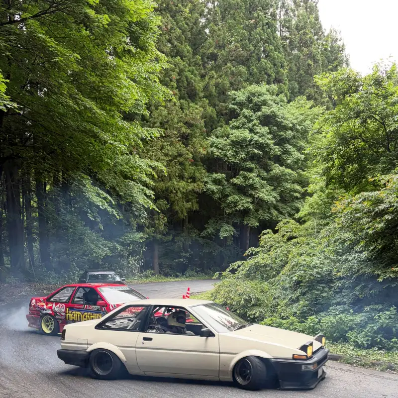 Two modified AE86 Hachi-Roku cars side by side