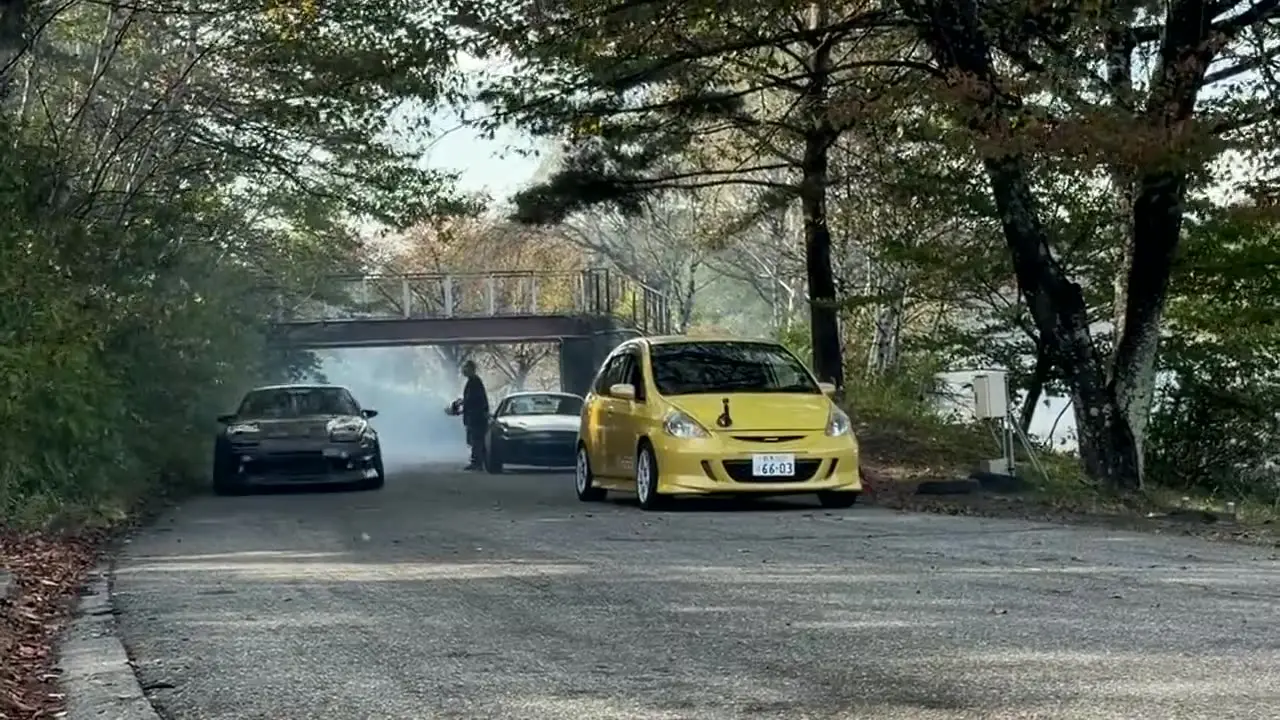 Tyre smoke from a drifting AE86 on a mountain course